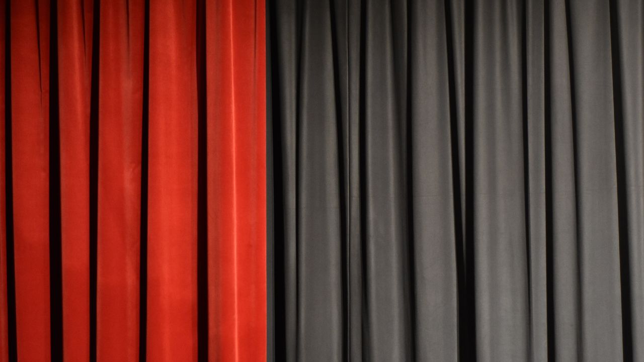 A red and black curtain

Description automatically generated